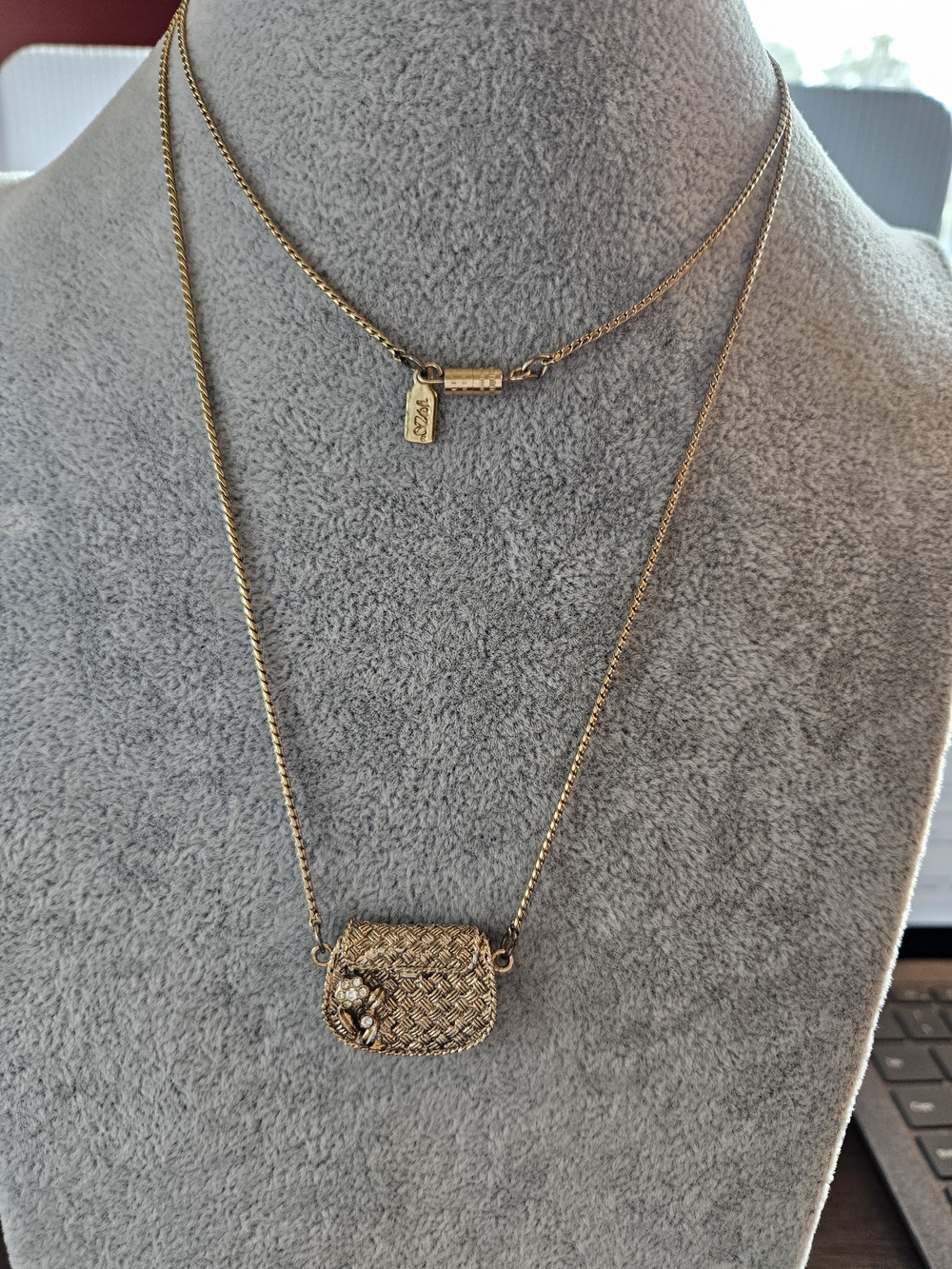 Vintage 1928 Brand Textured Purse Pendant Necklace With Flower And Rhinestones.